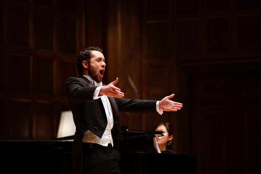 Voilin performers at music stands at University of Rochester Eastman School of Music Institute for Music Leadership